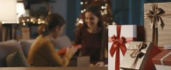 Mother and daughter exchanging Christmas gifts