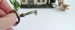 Real estate house with hand with key