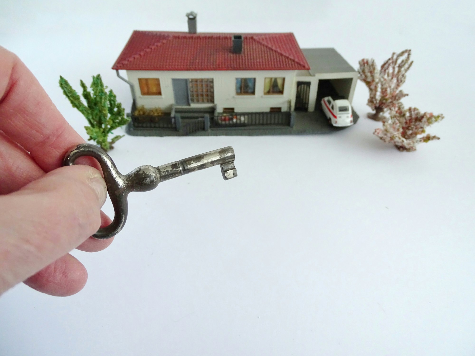 Real estate house with hand with key