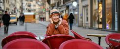 Woman in a hat talking on a cell phone