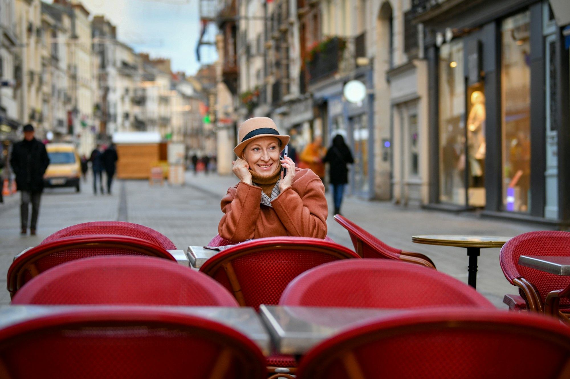 Woman in a hat talking on a cell phone