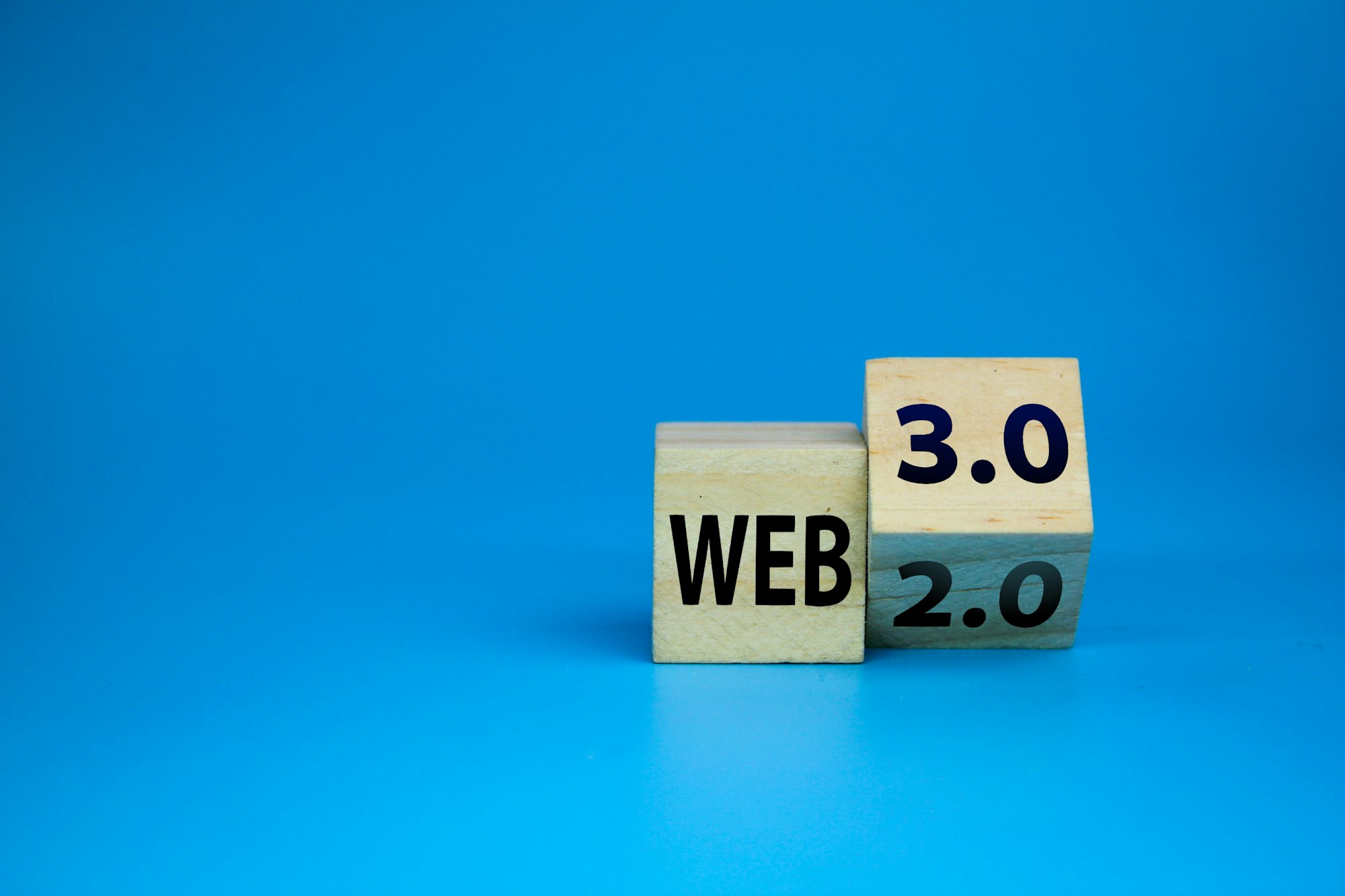 wooden cube with the words web 3.0 or 2.0.